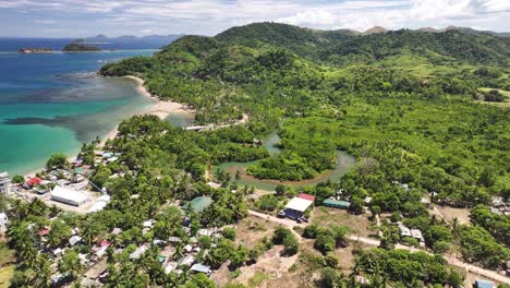 remote village in busuanga island, aerial view of lush greenery and the coastline