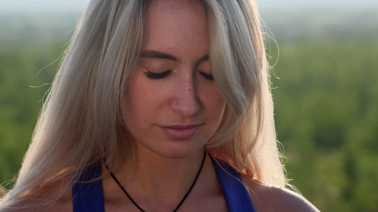 Smiling Blonde Woman in Nature