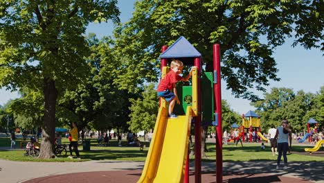 child playing on a playground slide