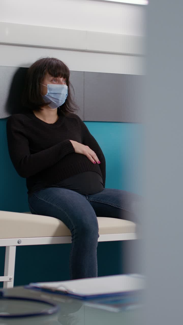 Pregnant woman having a medical consultation