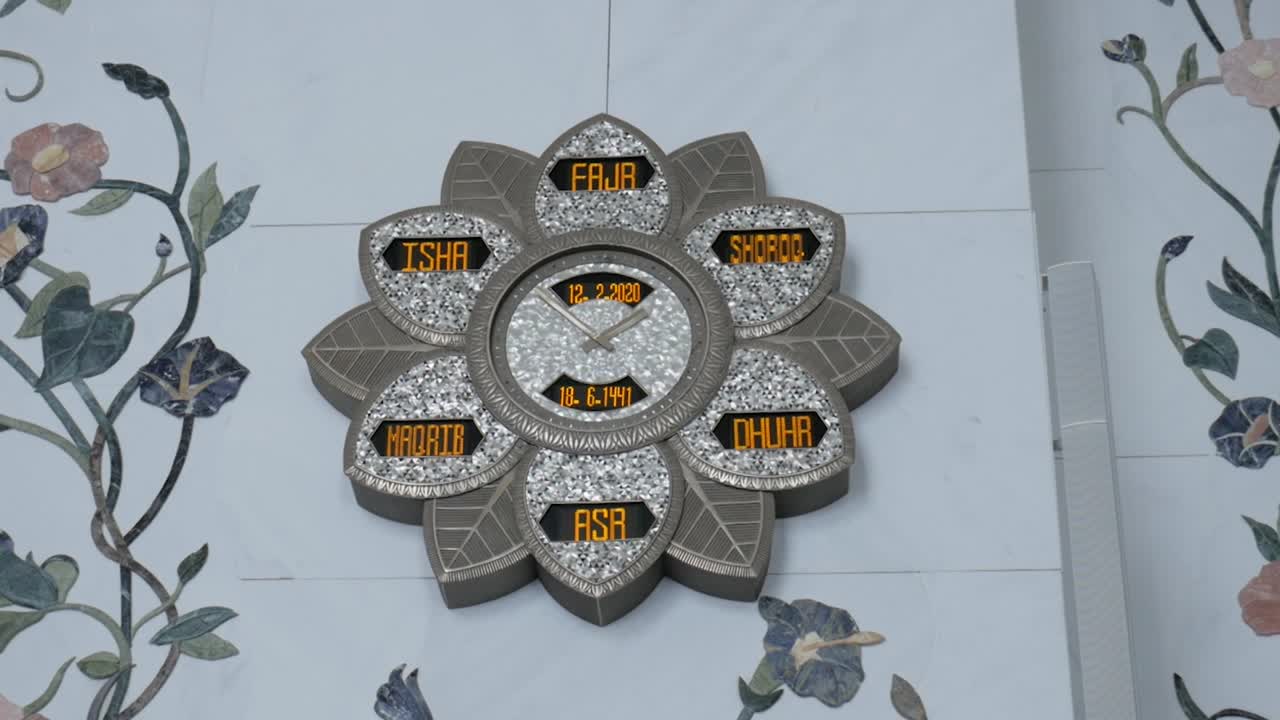 Flower islamic prayer clock with prayer timings on masjid wall