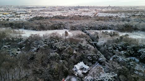 uk snowy blast brings winter wonderland - view of wirral peninsula from bidston hill, wirral - aerial drone 360 degree rotate around windmill