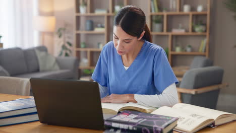 a nurse studying medical textbooks at home