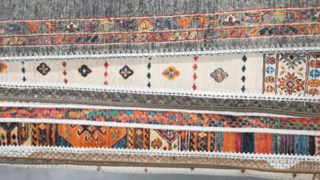 stack of colorful and patterned rugs