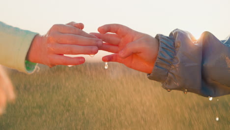 Children play with fingers in rainy weather closeup sister and brother collective spirit imbued with