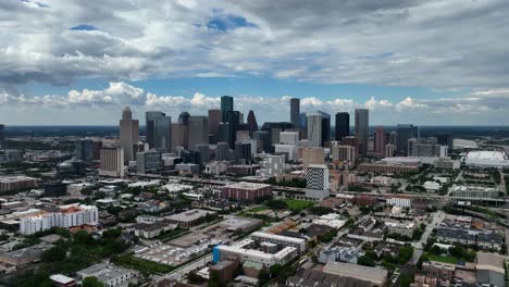 drone moving backwards over suburbs with houston skyline in the background - end screen