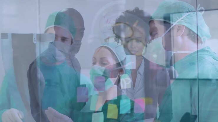 Animation of diverse coworkers over caucasian female and male surgeons