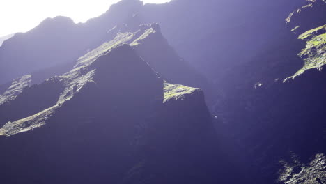 majestic mountain peaks illuminated by sunlight in a serene landscape
