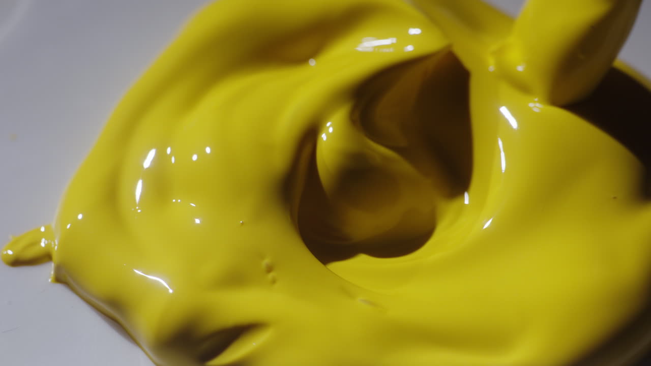 Yellow Paint Pouring and Mixing