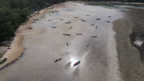 Aerial-view-of-Thailand's-seaside-pier-showing-boats-in-crystal-clear-water-off-the-coast-of-Koh-Phangan-Island's-Malibu-Beach