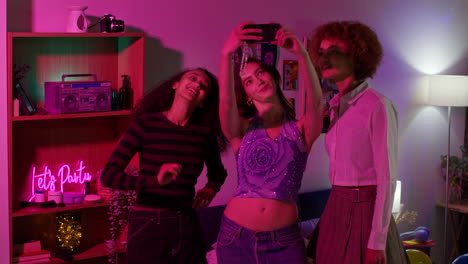 friends taking a selfie at a party