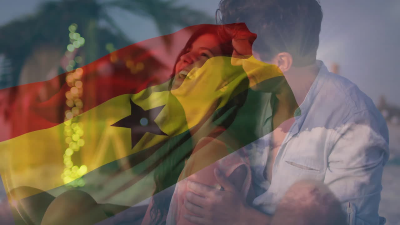 Embracing on beach, couple with Ghana flag animation overlay in background