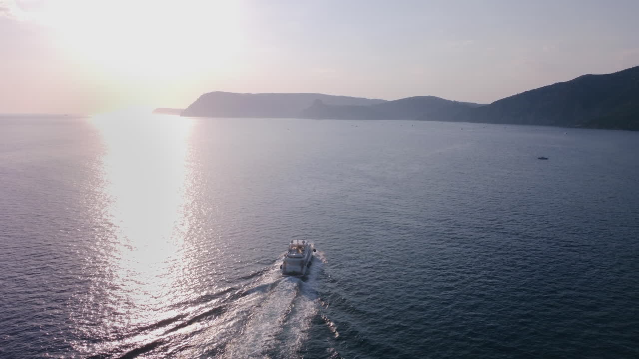 Yacht Sailing at Sunset