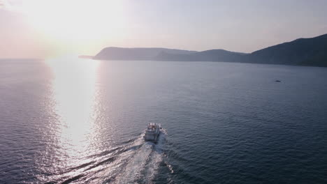 yacht sailing at sunset