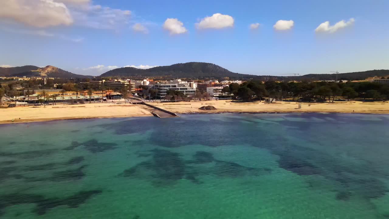 Enjoy the stunning turquoise waters and serene sandy shores of Santa Ponsa in Mallorca. This tranquil location features picturesque landscapes and vibrant coastal life, perfect for relaxation.