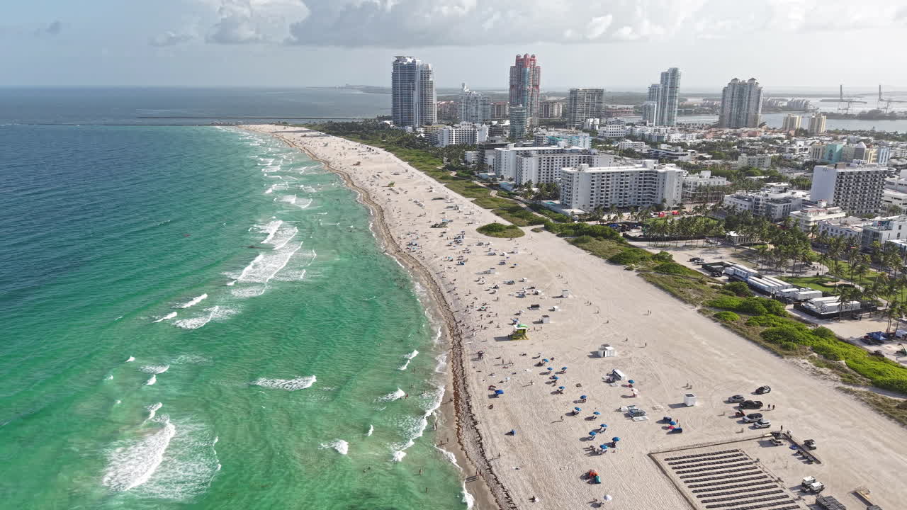 Aerial View of Miami Beach, Florida USA on Hot Sunny Day, Sand Waves and Buildings, Drone Shot