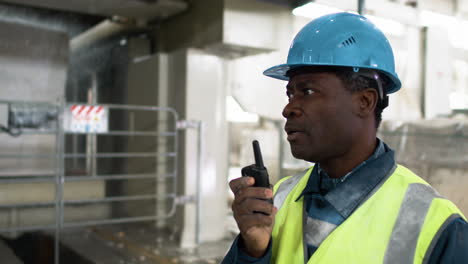 man talking on walkie talkie