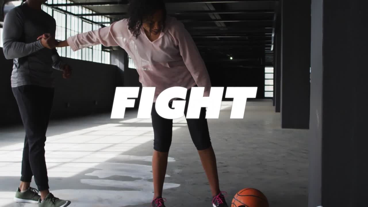 Vertical video: Walking coach pulling tired woman in pink hoodie up in gym, grabbing ball, resuming