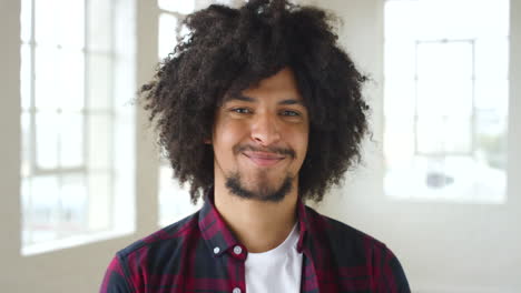 headshot of a happy male with a beard looking calm