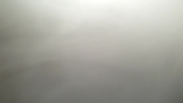 Slow motion fog and smoke moving across textured surface, perfect for eerie, scary and mysterious atmosphere presentations