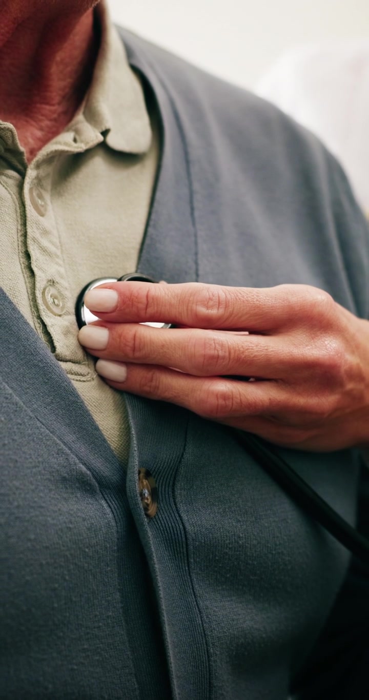 Doctor Using Stethoscope to Examine Senior Patient