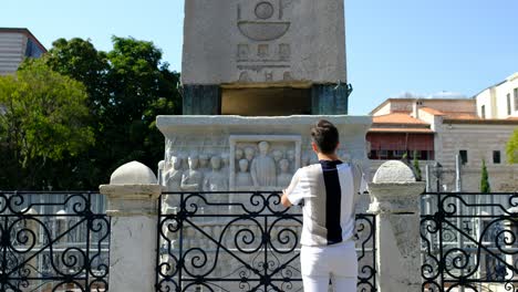 Istanbul-Obelisk-young-man-examining-obelisk