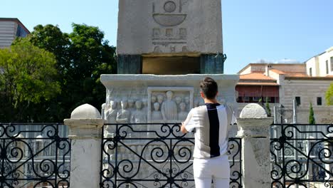 istanbul obelisk young man examining obelisk