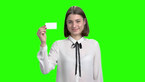 cute young girl shows blank business card.