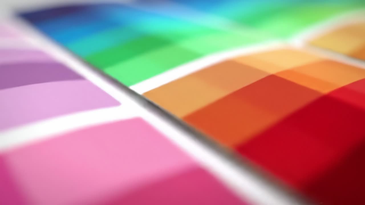 A mesmerizing assortment of colors transitions smoothly as geometric shapes blend together in an artistic expression. Experience this stunning visual art on display.