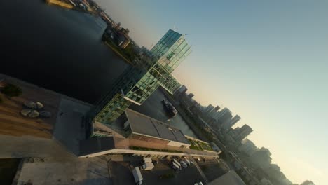 fpv drone soars along scenic overlook tower, industrial textures and cityscape at sunset, dynamic and fast-paced view