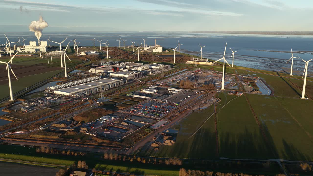 Aerial drone video overview of a new data center facility in Eemshaven, Netherlands, built for servers, machine learning, and big data infrastructure, reflecting huge digital demand