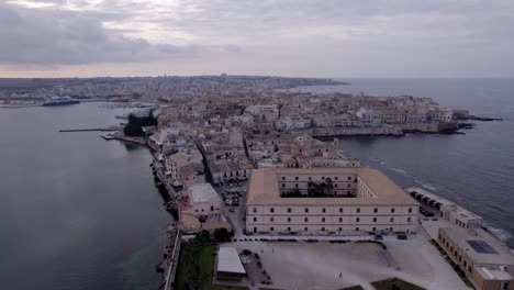 Aerial-Sideways-faculty-of-Architecture-Ortigia-island,-sundown-Sicily