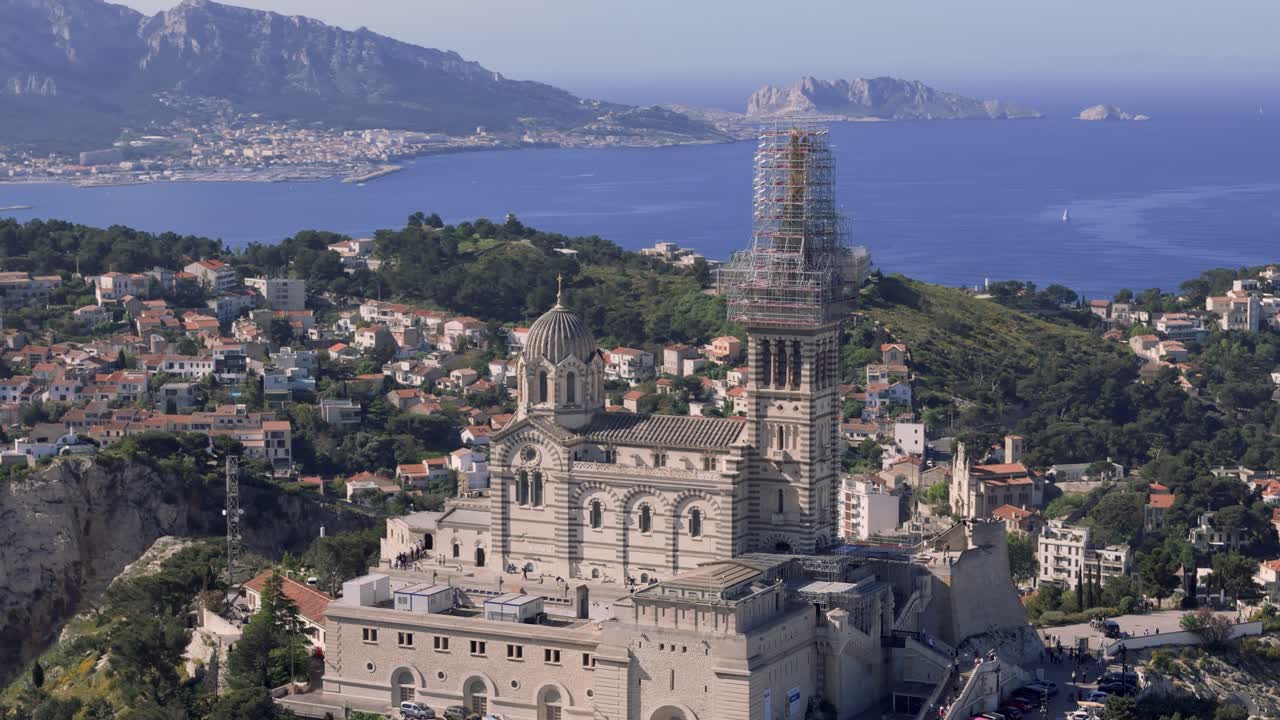 Drone spin around Notre Dame de la Garde, French landscape in background, Marseille France
