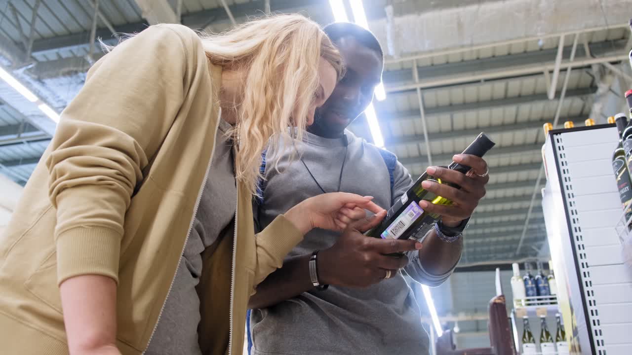 Couple Shopping for Wine in a Grocery Store