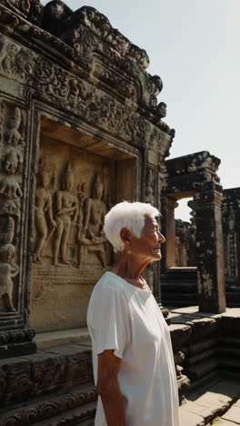 elderly woman at angkor wat temple in cambodia