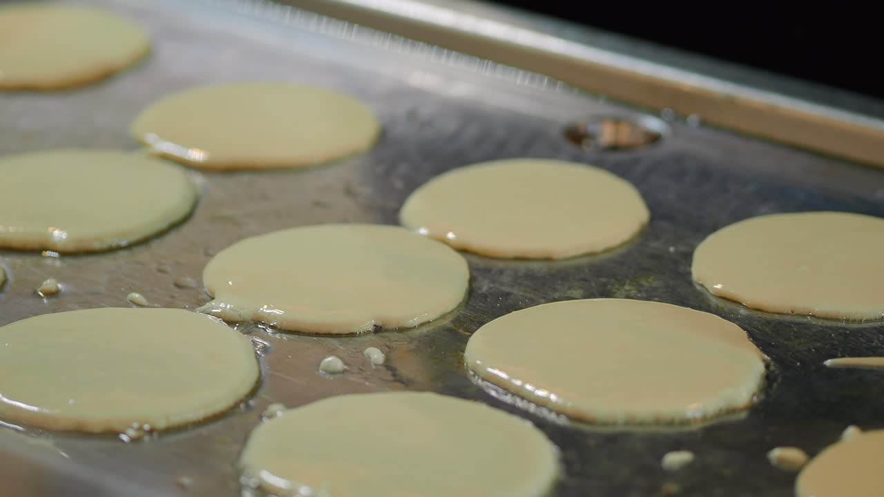 Pouring Pancake Batter onto a Hot Griddle