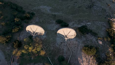 aerial view of satellite dishes on a mountaintop