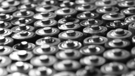black and white color top view on rows of aa energy batteries abstract background black and white color top view on rows of aa energy batteries abstract background of colorful batteries several batteries are standing nearby lots of aa batteries
