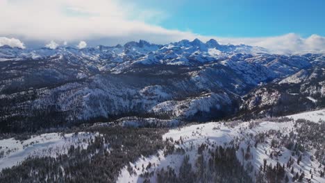winter spring mammoth mountain ski resort california hemlocks ritter range sierra nevadas minarets summit vista sunny blue sky snowy clouds over jagged peaks inyo sierras national forest backwards