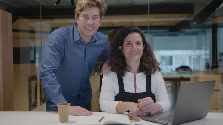 Portrait of Middle Aged Colleagues at Office Workplace