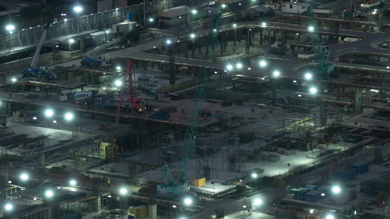 Time lapse of construction site with heavy construction machinery in metropolis