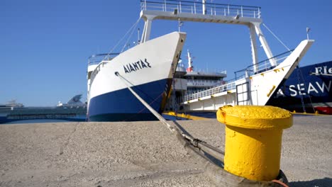 A-ferry-waiting-for-loading,-docked-at-the-port-on-the-shores-of-the-Ionian-Sea