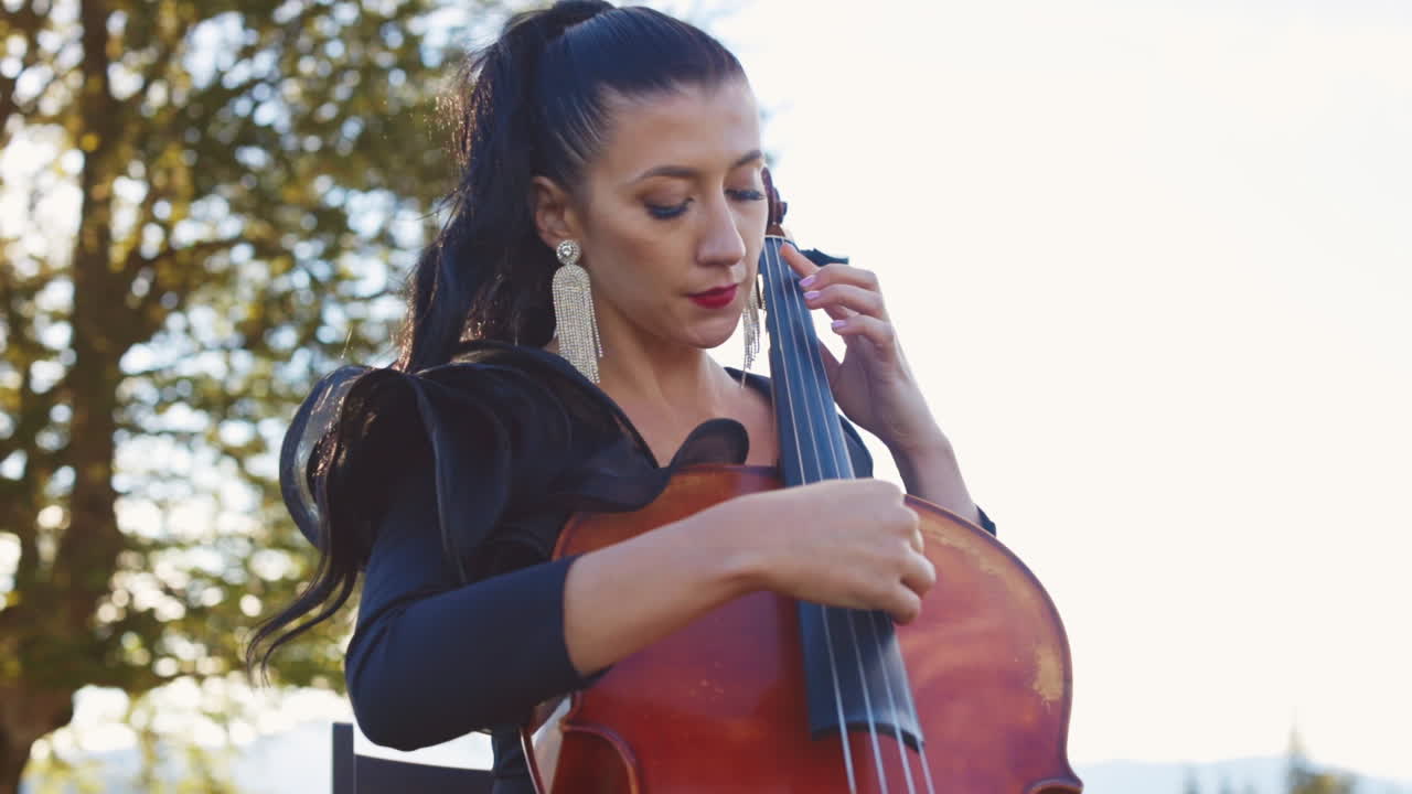 Woman Playing Cello Outdoors