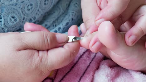 cosmetologist beautician is making pedicures in cosmetology clinic using nippers-6