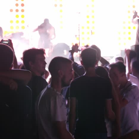 young people dancing in night club