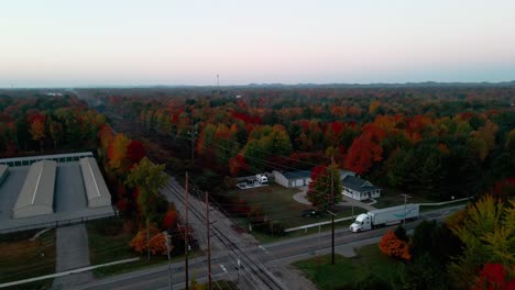 Deep-Fall-colors-lining-a-railroad-track-in-Muskegon,-Michigan