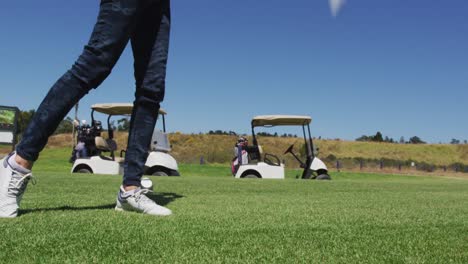 Caucasian-senior-woman-practicing-golf-at-golf-course-on-a-bright-sunny-day