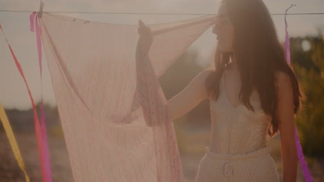 beautiful young female brunette standing by sarong