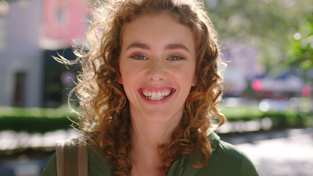 Headshot of a cute smiling student with curly