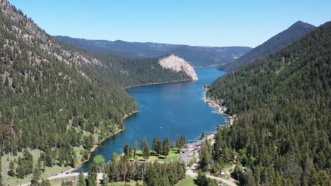 escape to paradise: embrace the serenity of paul lake in kamloops on a sunny day, surrounded by majestic forest mountains